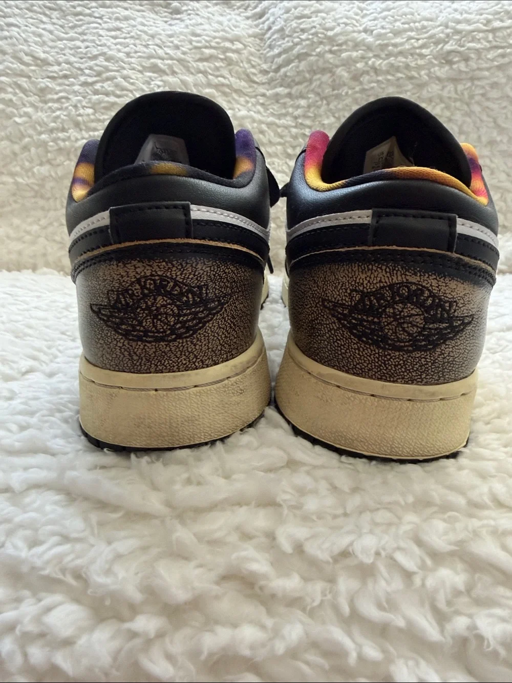 Nike Air Jordan’s Low-Top Sneakers in White, Black and Bronze. Size 7Y.